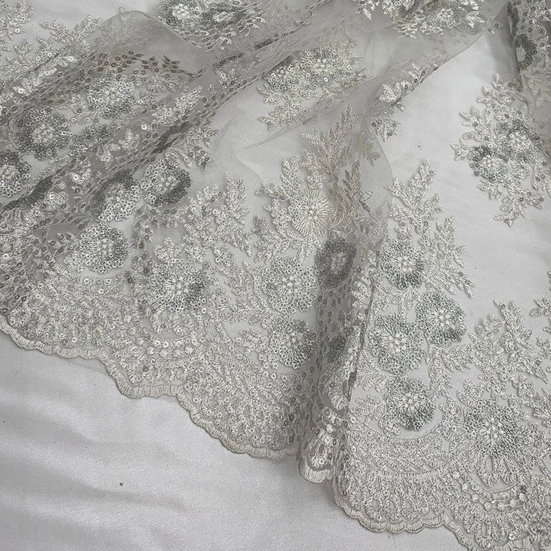 Embroidered Corded Metallic Flowers On Mesh Lace Fabric With SequinsICEFABRICICE FABRICSWhite/SilverEmbroidered Corded Metallic Flowers On Mesh Lace Fabric With Sequins ICEFABRIC White/Silver