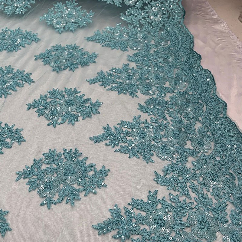 Embroidered Corded Metallic Flowers On Mesh Lace Fabric With SequinsICEFABRICICE FABRICSAquaEmbroidered Corded Metallic Flowers On Mesh Lace Fabric With Sequins ICEFABRIC Aqua