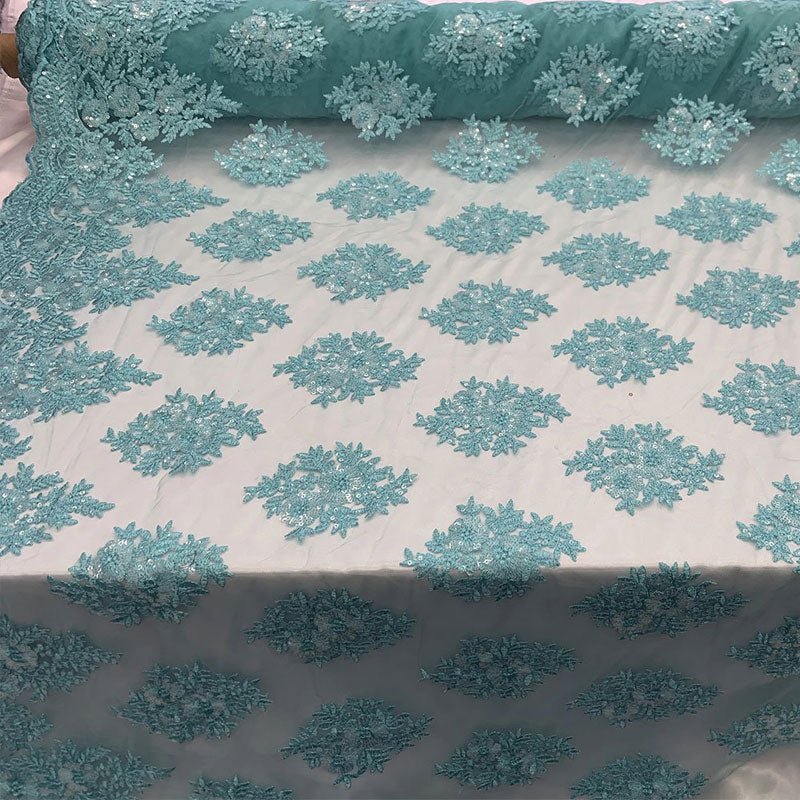 Embroidered Corded Metallic Flowers On Mesh Lace Fabric With SequinsICEFABRICICE FABRICSAquaEmbroidered Corded Metallic Flowers On Mesh Lace Fabric With Sequins ICEFABRIC Aqua