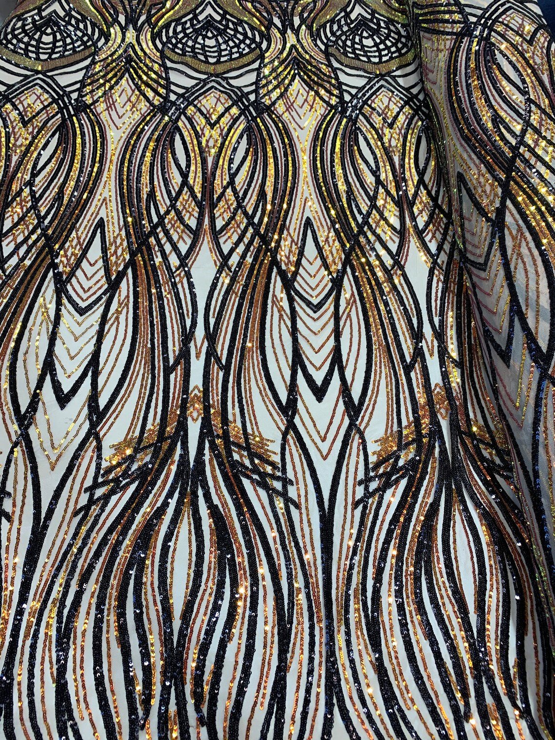 Peacock Iridescent Orange-Black Sequin Fabric on 4 Way stretch MeshICE FABRICSICE FABRICSBy The YardPeacock Iridescent Orange-Black Sequin Fabric on 4 Way stretch Mesh ICE FABRICS