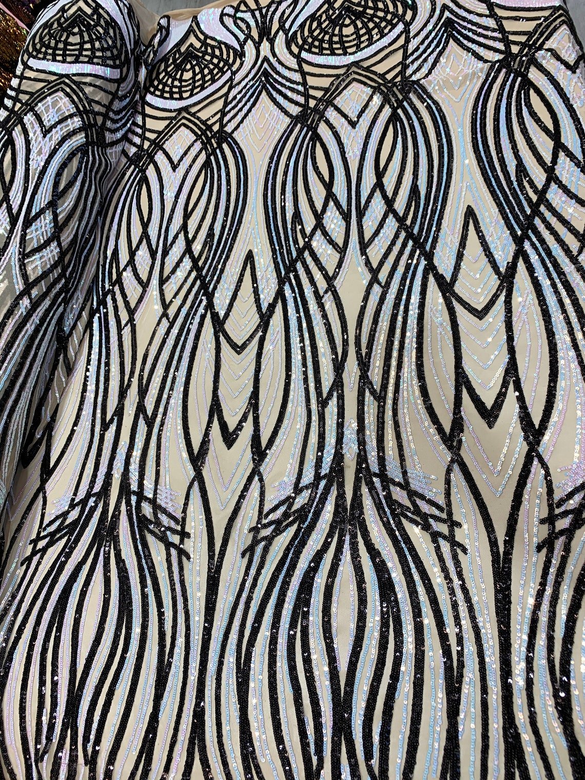 Peacock Iridescent Sky Blue-Black Sequin Fabric on 4 Way stretch MeshICE FABRICSICE FABRICSBy The YardPeacock Iridescent Sky Blue-Black Sequin Fabric on 4 Way stretch Mesh ICE FABRICS
