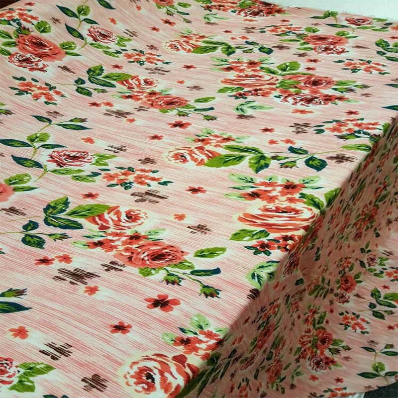 Rayon Crepon Textured Coral And Green Floral Flowers On Pink Background FabricICEFABRICICE FABRICSChallis FabricRayon Crepon Textured Coral And Green Floral Flowers On Pink Background Fabric ICEFABRIC